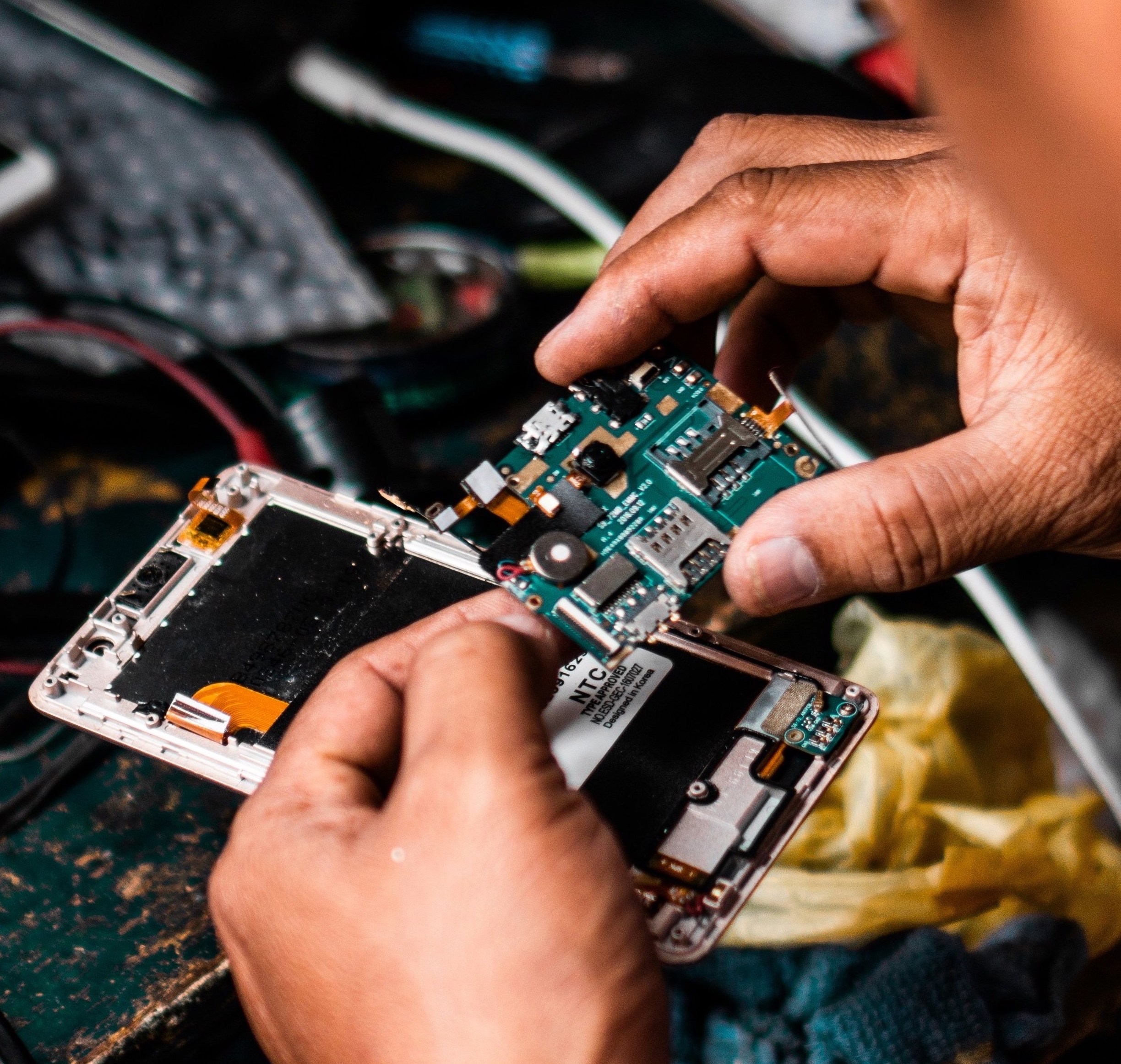 Technician repairing phone